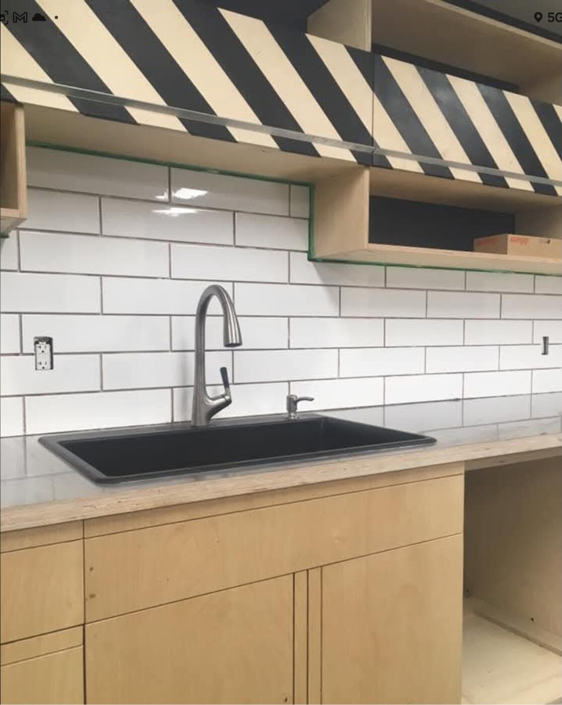 White subway tile backsplash installation